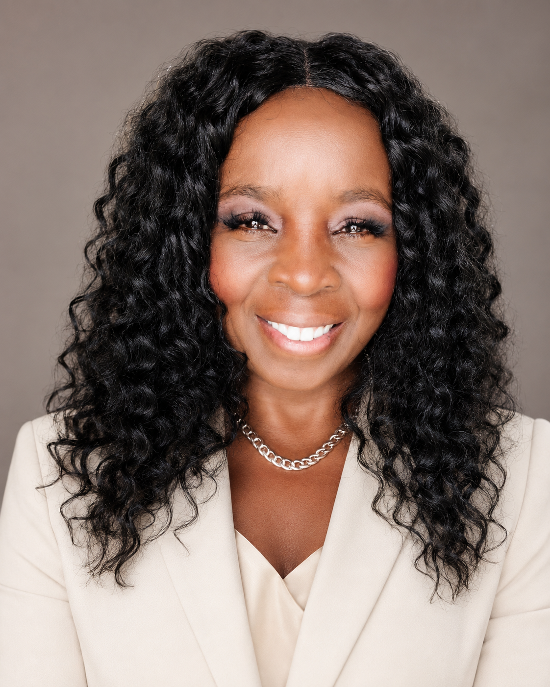 Tracy Washington in a cream blazer